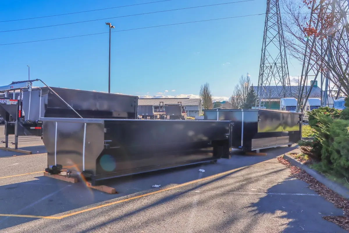 Roll-off dumpster ready for waste disposal at job site for Concrete Dumpster Rental in Horace